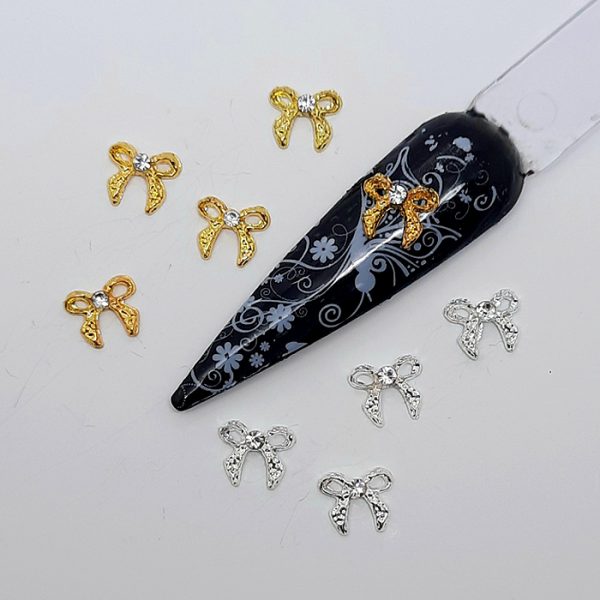gold and silver metal ribbon bow nail charms with gems
