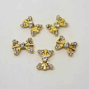 large gold bow nail charms with gems