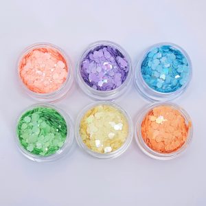collection of 6 pots of nail glitter in pastel colours