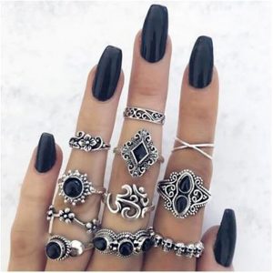 silver costume jewellery ring set with black gems