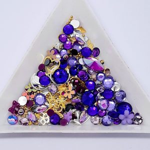 treasure pot of purple themed mixed nail decoration including gems and gold and silver metal charms and caviar beads